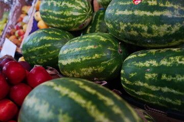 Sale of various greens for salads on the market.