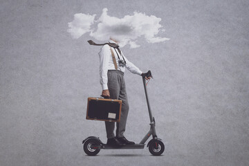 Man with head in a cloud riding a scooter