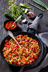 Hoppin John of black-eyed peas, veggies, sausages