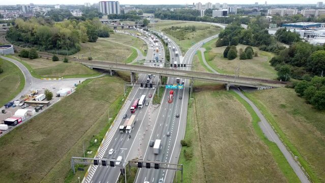 Traffic driving on E34 ring road in Antwerp before Kennedy tunnel. Drone view from above