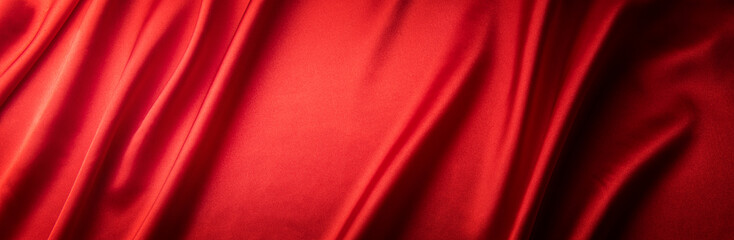 赤いシルクの布の背景テクスチャー