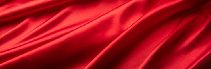 赤いサテンの布の背景テクスチャー