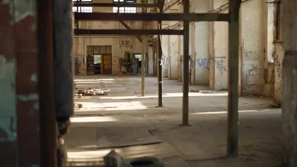 Foto op Canvas Inside empty abandoned industrial factory © Video_StockOrg