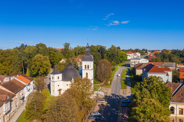 Croatia, Slavonia, town of Daruvar, catholic church in autumn, panoramic drone view
