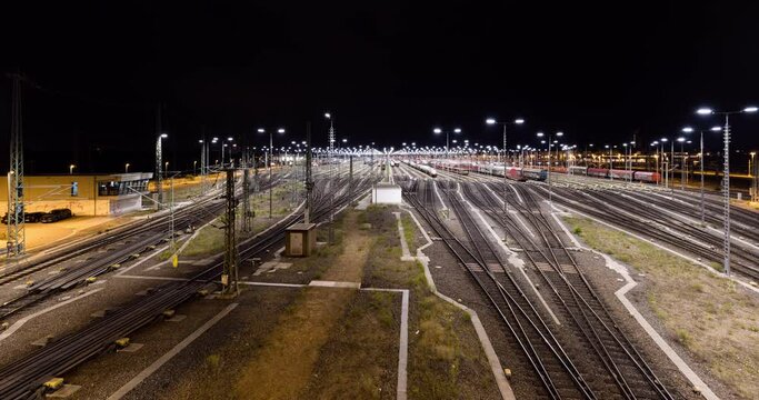 Train yard at night. Time lapse of train shunting at a main junction in 4k.