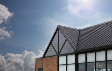 Modern house roof on blue sky background.