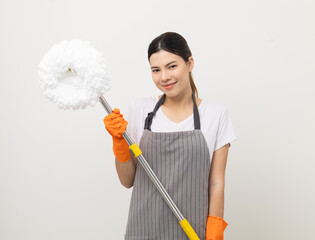 Young beautiful woman with apron and rubber glove ready for cleaning home on isolated white background. Housekeeping housework or maid worker holding mop cleaning