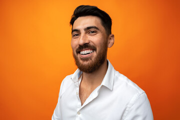 Portrait of handsome smiling businessman on studio background