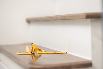 Banana peels are placed on the stairs of the house to risk accidents. If anyone stepped on it may...