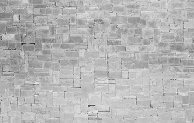 Surface of Vintage white brick stone wall background.