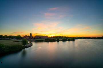 Old windmill on Caldecotte lake at sunset in Milton Keynes. England