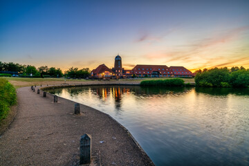 Old windmill on Caldecotte lake at sunset in Milton Keynes. England