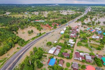 High-angle view of the Great Flood, Meng District, Thailand, on October 3, 2022, is a photograph from real flooding. With a slight color adjustment
