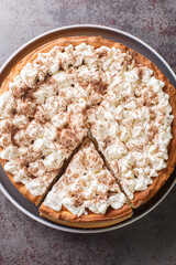 Sweet pie with a filling based on rice pudding topped with whipped cream and chocolate chips...