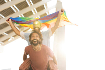Happy couple with a pride flag. LGBT community.
