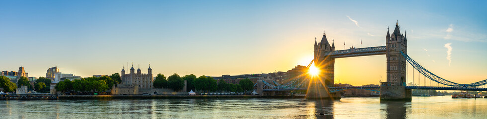 Naklejka premium Tower Bridge and city of London financial district at sunrise. England