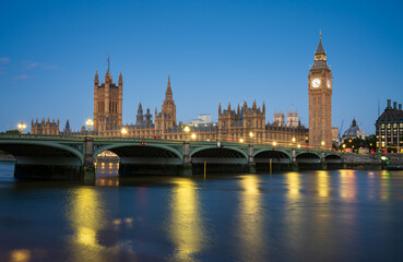 Big Ben and Westminster bridge at dawn in London. England