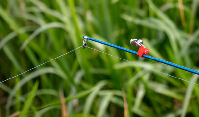 Fishing rod in nature in summer.