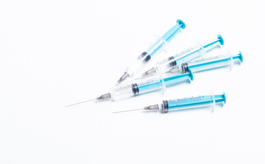 Medical syringe on a white background. A syringe for injection. The concept of health and beauty