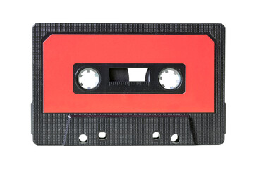 An old retro cassette tape from the 1980s (obsolete music technology). Black fine grid plastic...