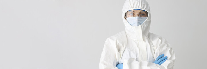 Doctor scientist in protective suit, mask and glasses
