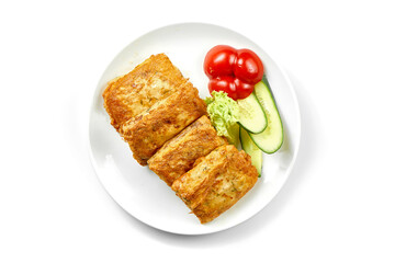 Crepes with stuffing and salad in a white plate. Close-up, selective focus. White background