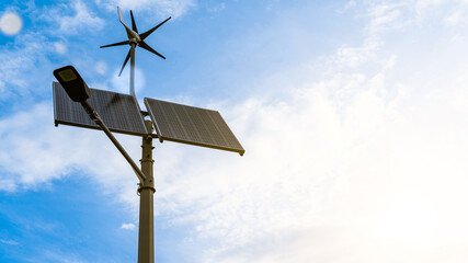 Wind turbines solar panels. Renewable photovoltaic technology with solar energy power panel and...