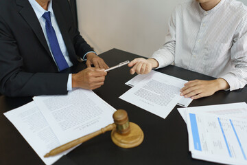 Lawyer and justice concept, Businessman receives a pen from senior lawyer to signing contract