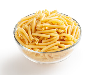 Uncooked maccheroni pasta in glass bowl isolated on white background with clipping path