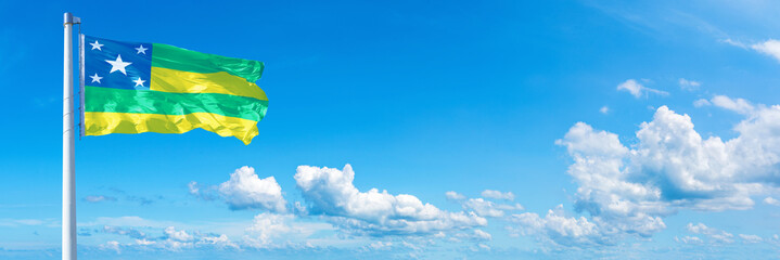 Sergipe - state of Brazil, flag waving on a blue sky in beautiful clouds - Horizontal banner - obrazy, fototapety, plakaty