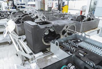 Production of transmissions for agricultural machinery at modern industrial plant or factory close-up.