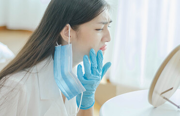 woman squeezing acne.