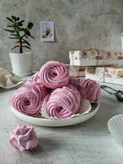 Homemade marshmallow pink. The dessert is made from apple puree and berry currants. Very useful and natural sweetness.