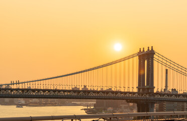 Manhattan Bridge at dawn and some disc of the rising sun