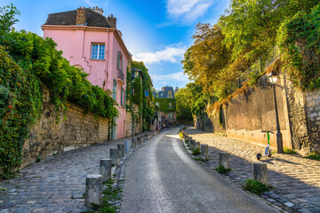 View of old street in quarter Montmartre in Paris, France. Cozy cityscape of Paris. Architecture and landmarks of Paris