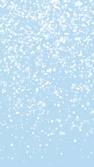Snowfall overlay christmas background. Subtle flying snow flakes and stars on light blue winter backdrop. Festive snowfall overlay. Vertical vector illustration.