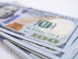 Close up, American one hundred dollar banknote. Selective focus at number 100..