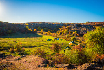 Camping on the hills near the river in the autumn