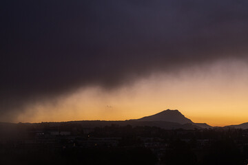 Sainte Victoire mountain in the sun of an autumn morning with thick fog