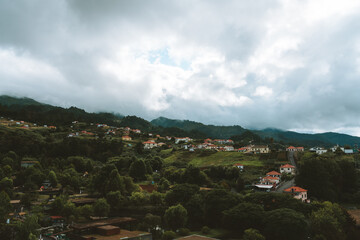 Fototapeta na wymiar The neighborhood of Santana in northern Madeira island in Portugal in a cloudy day and plenty of trees
