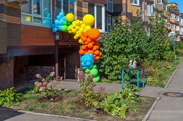 The entrance to the basement is decorated with colorful balloons