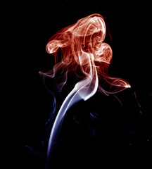 Red and blue smoke on dark background.