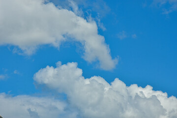 Naklejka na ściany i meble White clouds against blue sky for a backgrounds