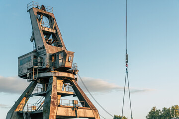 Fototapeta na wymiar dismantling an old port crane 
