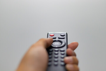 hand held remote, selective focus at remote, hand blured, space, sample space, free space, click...