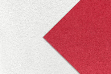Texture of white paper background, half two colors with red arrow sign, macro. Structure of craft...