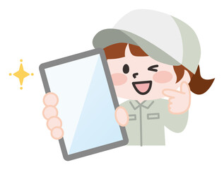 スマホを持ってポーズする女性作業員