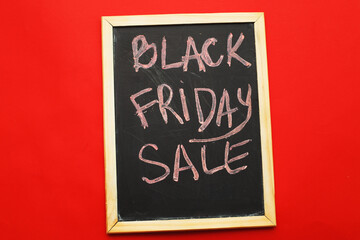 inscription black friday sale on a red background.
