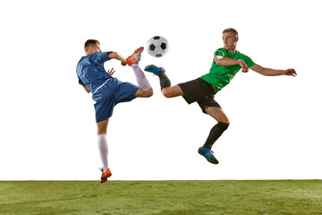 Two soccer players in action, motion on green grass flooring isolated over white background. Concept of global sport, championship, competition, football match