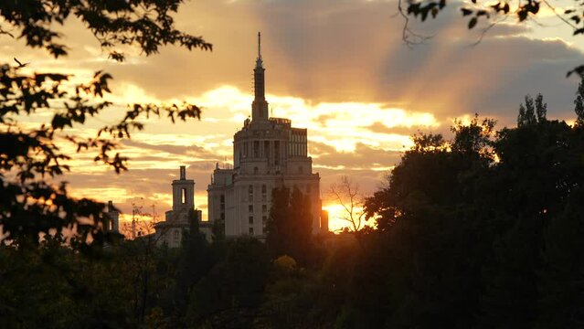 Autumn sunset over Free Press House (Casa Presei Libere in Romanian language) and Herastrau Park lake from Bucharest. Travel to Romania, amazing landscape in the heart of Bucharest, 2022.